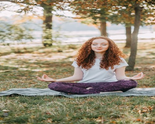 person meditating in nature for mindfulness